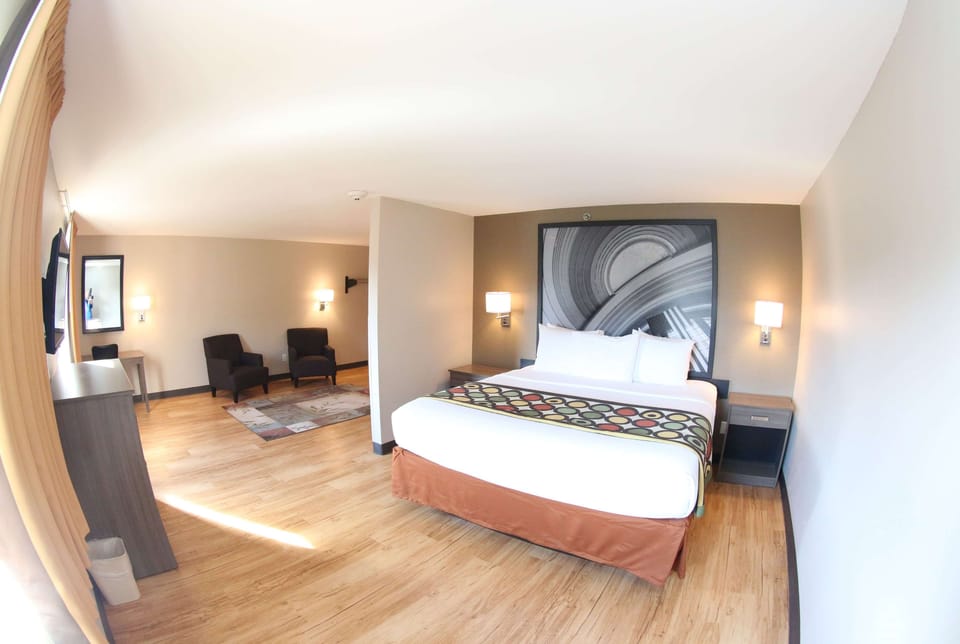 Suite, 1 King Bed, Non Smoking | Hypo-allergenic bedding, pillowtop beds, desk, blackout drapes