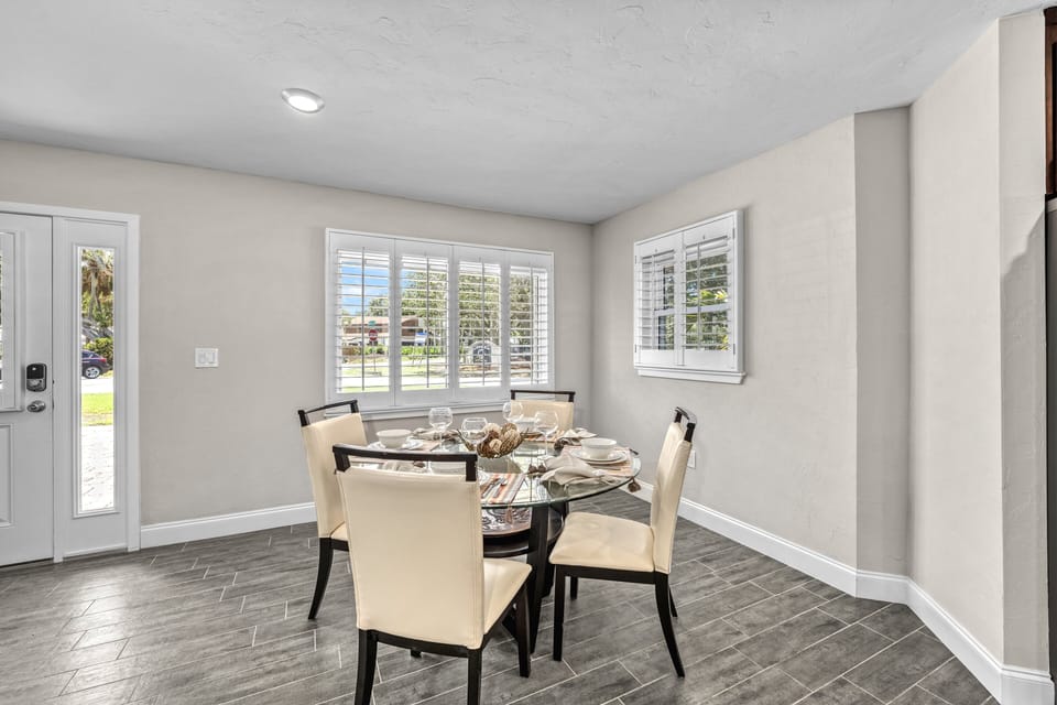 The dining area offers a relaxed setting for family meals or game nights.
