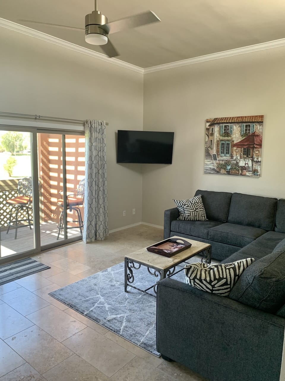Living room with balcony overlooking golf course