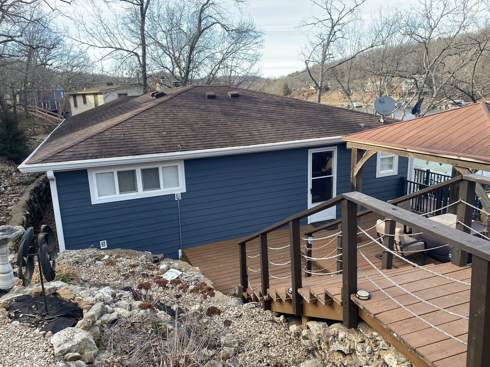 View of the house from the parking area. (With new siding Feb 2023)