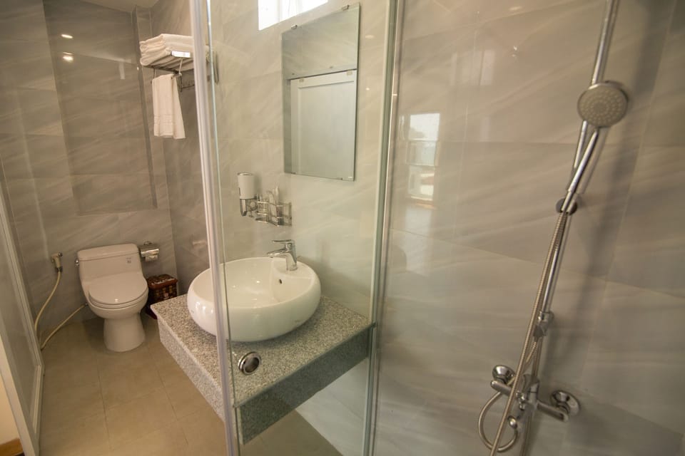Shower, free toiletries, slippers, towels