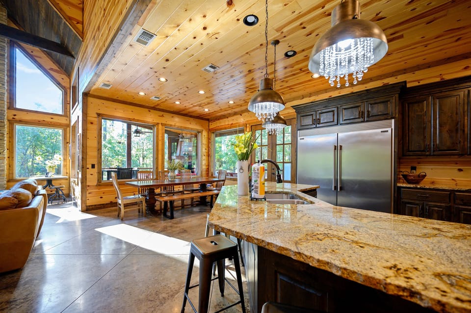 Gather around the large dining table and oversized kitchen island to share meals and stories after a day exploring Broken Bow Lake.