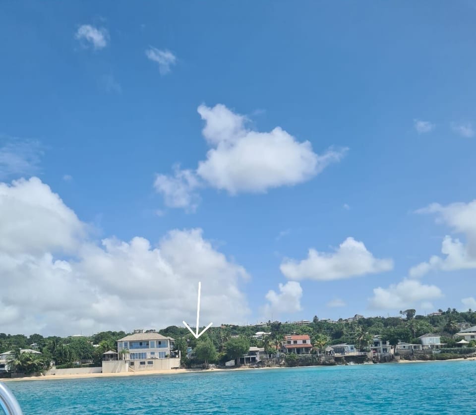 Sea view of Beachside Cottage - apts are behind the cottage.