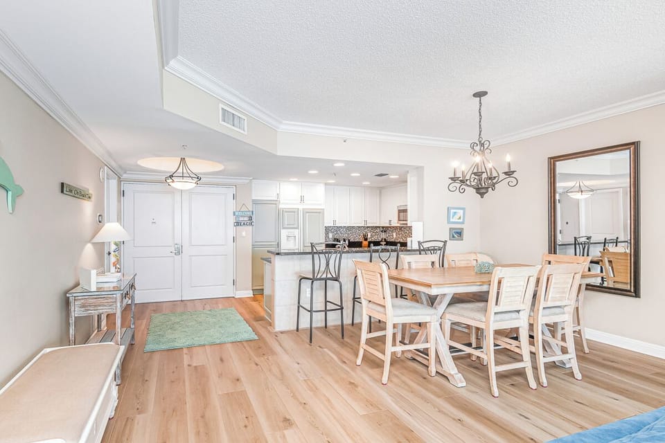 Gather around the spacious dining table where your group can share meals and create memories in this bright, open-concept space.