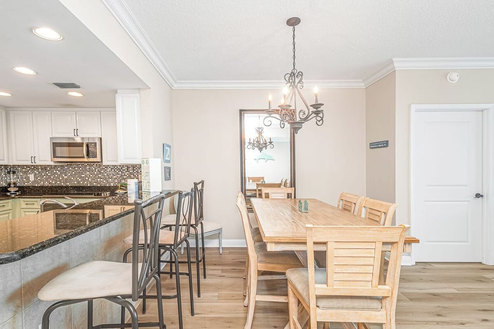 Gather around your spacious dining table for memorable meals, with a chef-worthy kitchen just steps away featuring granite counters and modern appliances.