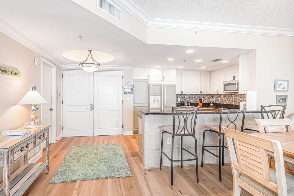 Your bright open-concept kitchen awaits with granite countertops, modern appliances, and breakfast bar for morning coffee.