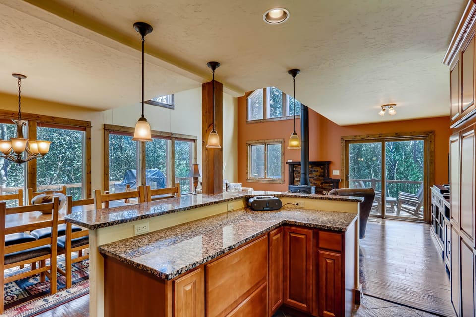 The dining room, great room, and kitchen are all open so that your entire group can gather around and have fun while cooking, eating, or relaxing.