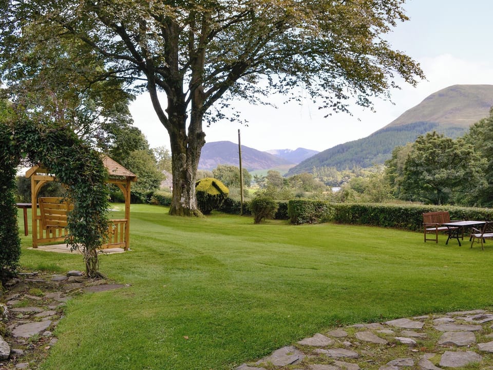 Peaceful gardens with sitting out areas | Lorna&rsquo;s At The Grange - Grange Country House Holiday Cottages, Loweswater, near Cockermouth