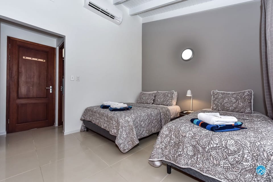 Our second bedroom upstairs has a queen bed and a single bed, great closet space