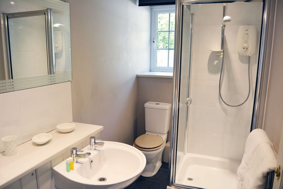 Ground floor: En suite shower room to large super-king size bedroom