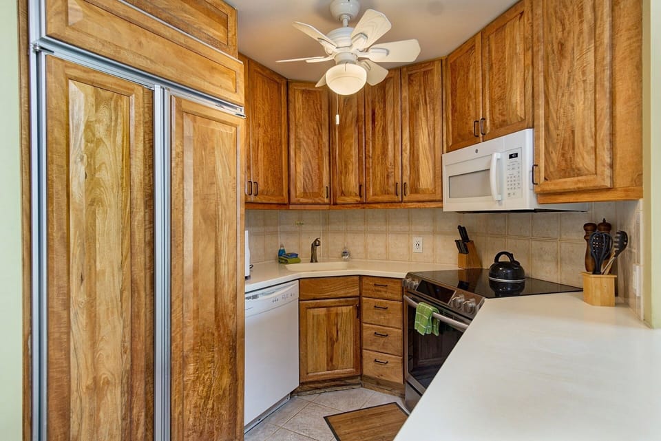 Nicely appointed kitchen. Mango wood cabinetry, Sub-Zero refrigerator, and modern appliances make this kitchen a chef's delight, perfect for preparing island-inspired meals.
