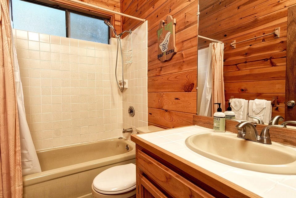 Convenient private bathroom off the primary bedroom, featuring a shower and comfortable layout.