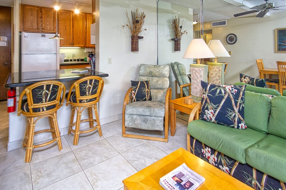 Bright living area with central A/C, ocean views, and a queen sofa bed for additional sleeping space.