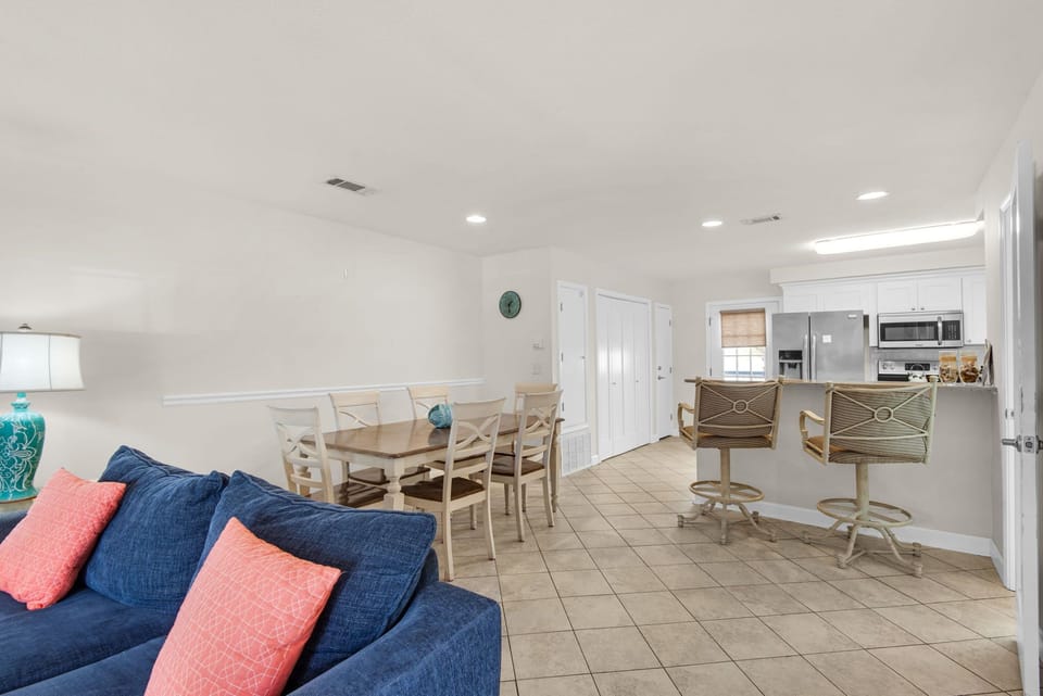 The open living area combines dining, kitchen and living room