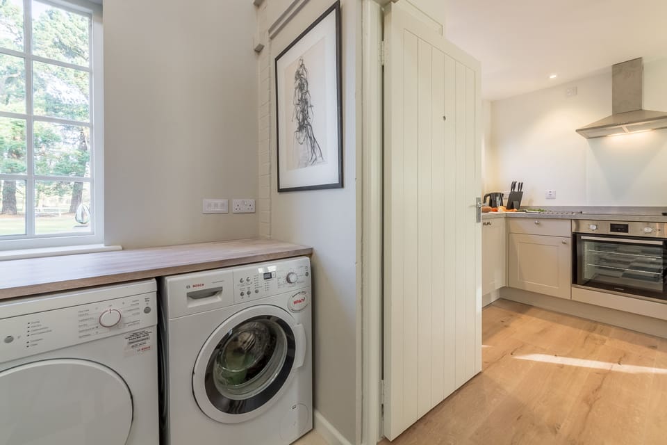 Ground floor: Shared entrance lobby with a shared washing machine and tumble dryer