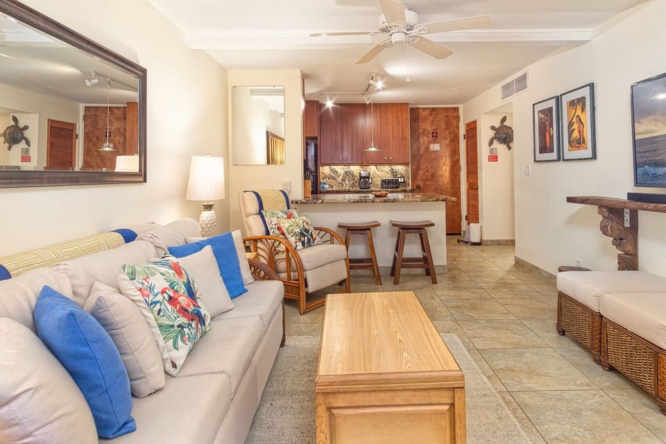 Relax in a bright, comfortable living space with central A/C, ocean views, and direct access to your lanai.