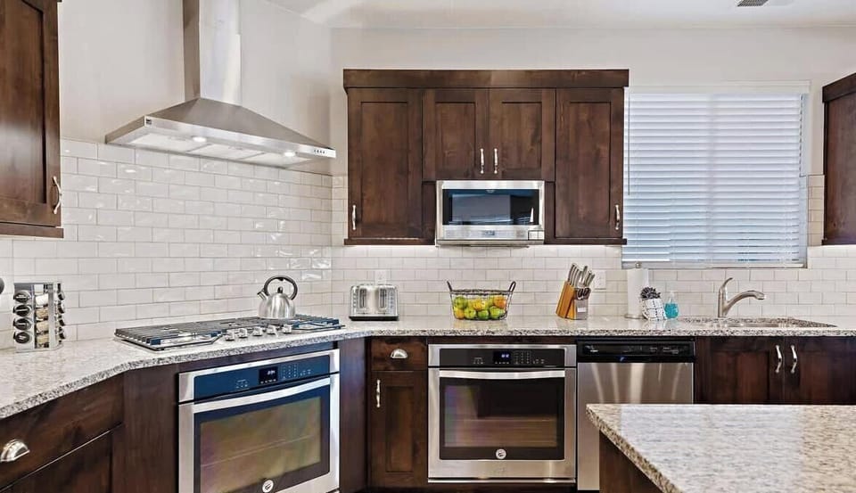 Large gas range, 2 ovens, dishwashers, and fridges