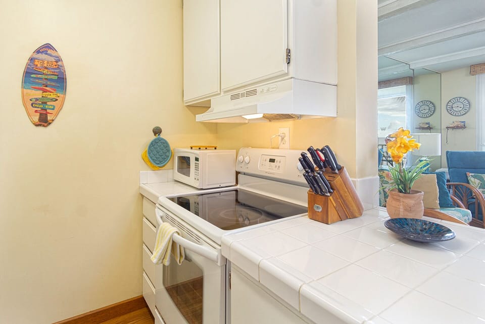 Fully equipped kitchen featuring modern cabinetry, quality appliances, and everything needed for meal preparation.