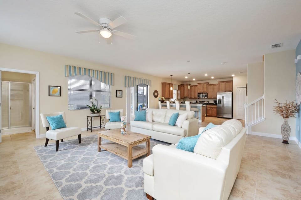 front view of luxuries villa living room  with tea table in wooden at The Retreat at ChampionsGate