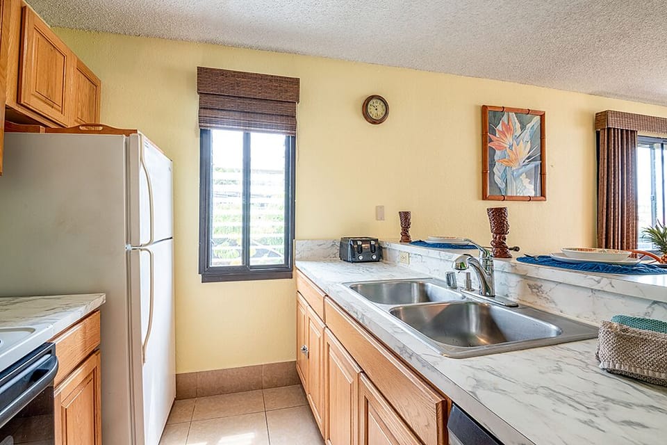 This full-size kitchen includes everything you need — appliances, cookware, and dishes — ideal for quick meals or full dinners.