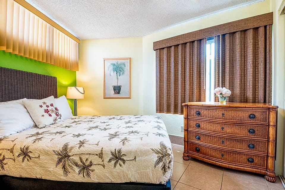 Rest comfortably in the bright queen bedroom with fresh linens, ceiling fan, and plenty of storage.