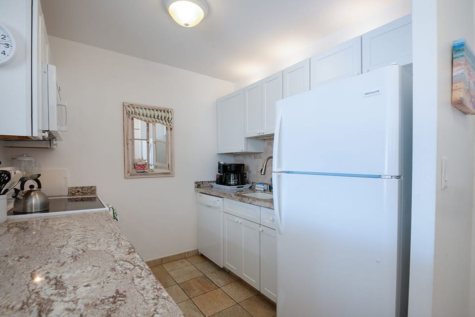 Enjoy a tastefully upgraded kitchen with modern appliances, ample counter space, and island-inspired style.