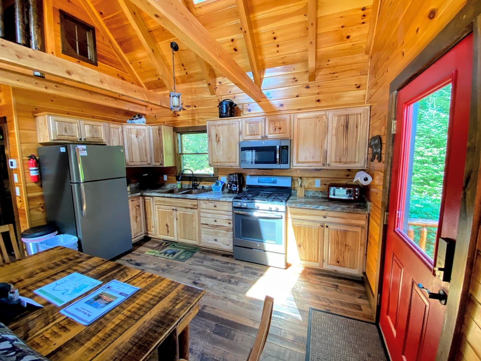 Kitchen and Dining. Table has two chairs and two benches