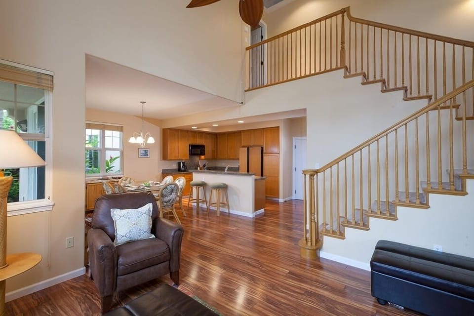 Spacious open layout connecting living room, dining area, and kitchen.