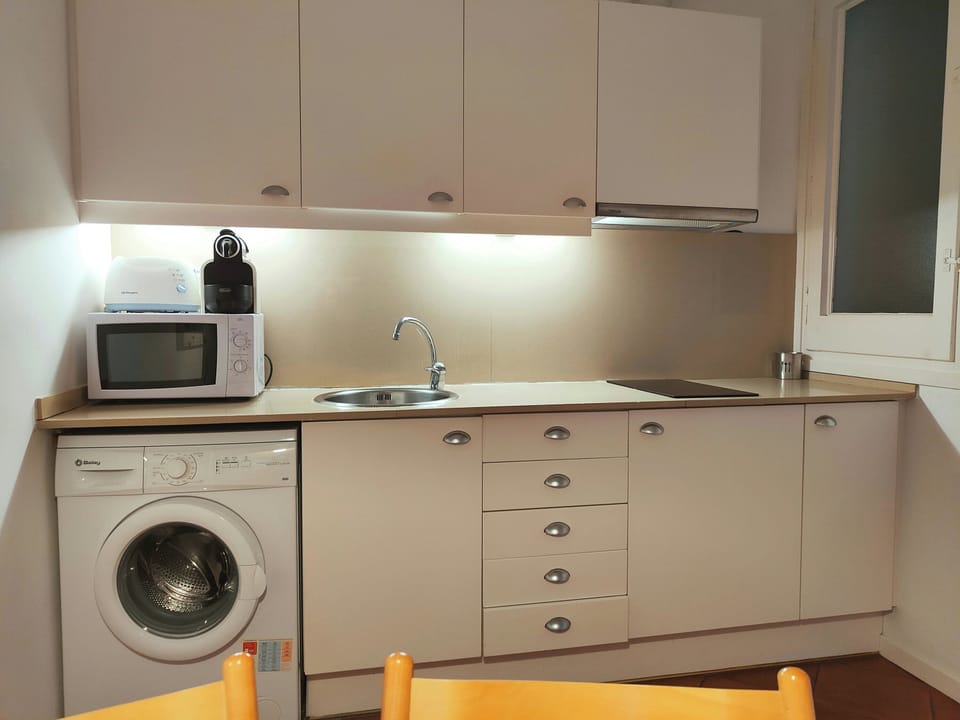 The kitchen counter offers ample space for preparing meals or enjoying a quick snack.