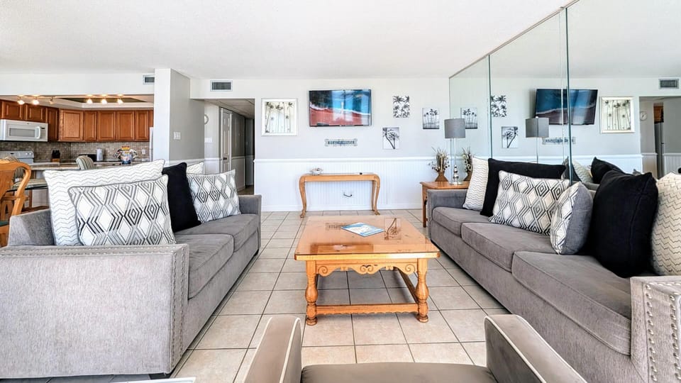 Spacious living room with cozy seating and bright natural light