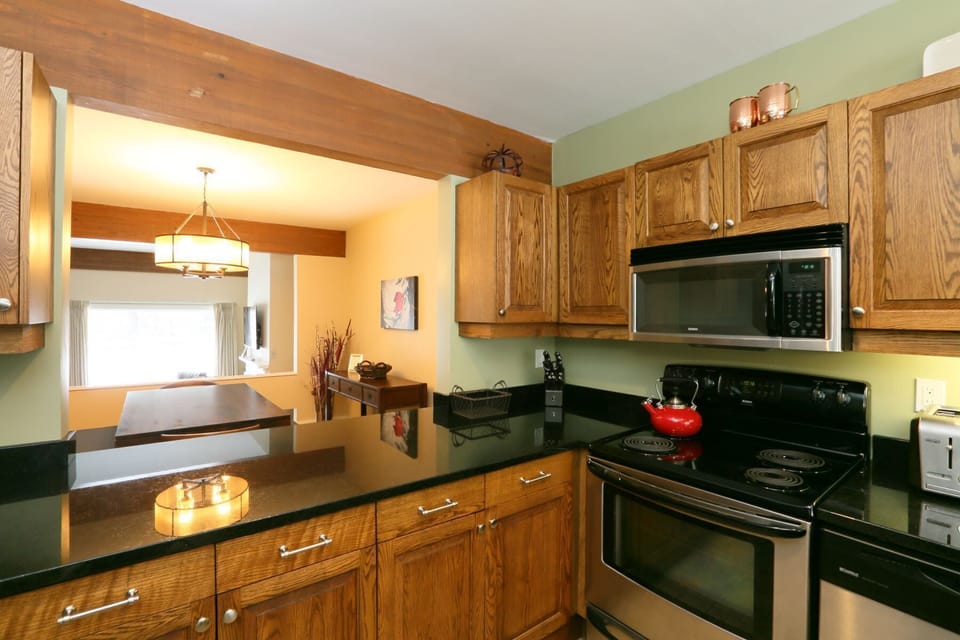 The kitchen pass-through makes it easy to interact with friends and family while preparing meals