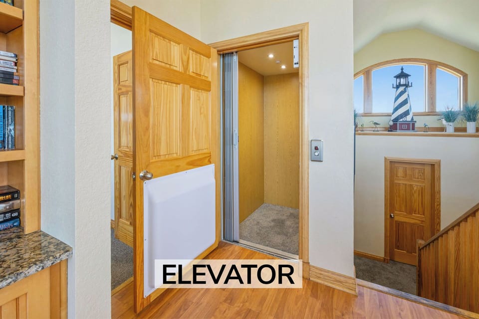 Surf or Sound Realty - 655 - Sunset Watch - Elevator - Label