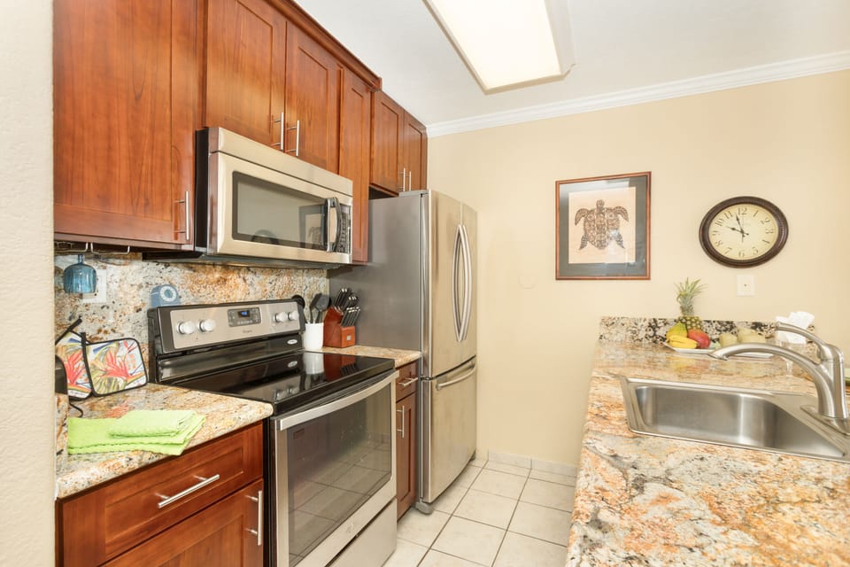 Remodeled full sized kitchen with amazing view for the chef. Granite countertops, full-size stainless appliances, and everything needed for cooking at home—plus an ocean view right from the kitchen.