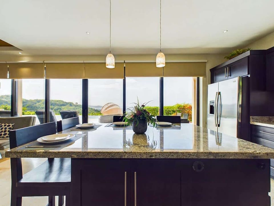 Open kitchen, stainless steel appliances, ocean views
