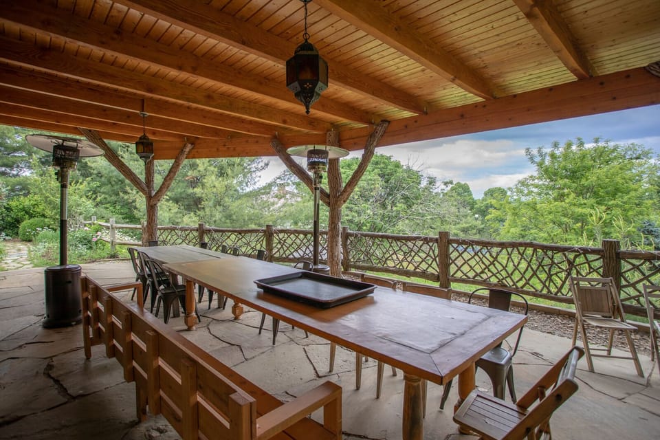 Covered Porch and Outdoor Dining Table with View