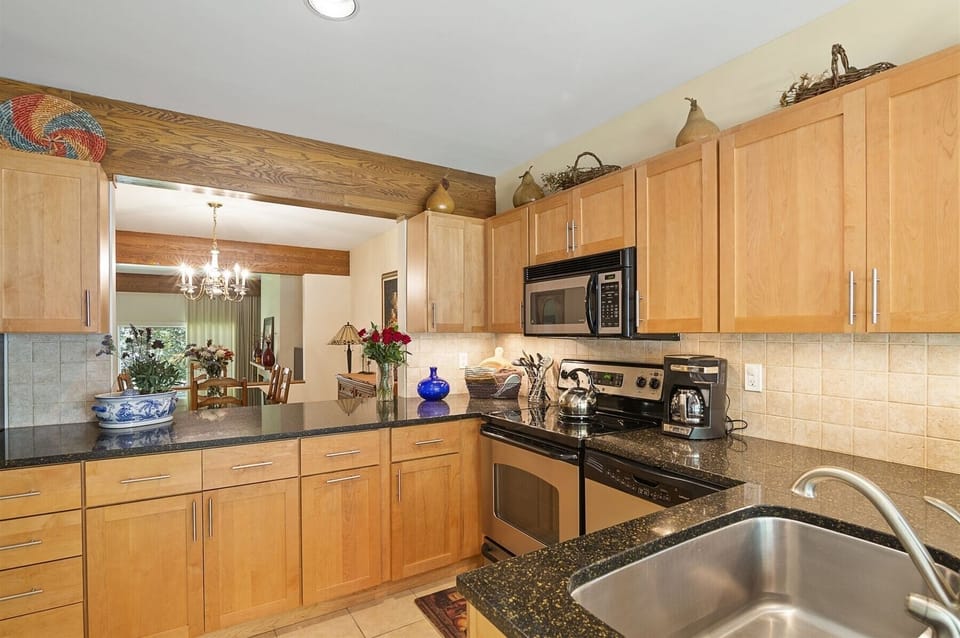The kitchen pass-through makes it easy to interact with friends and family while preparing meals
