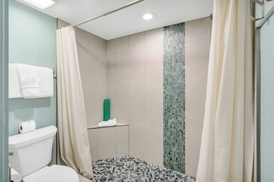 Large walk-in shower with bench