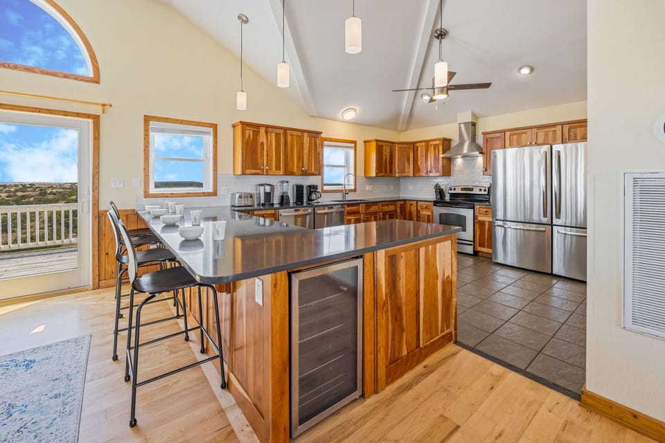 The spacious kitchen is well equipped with stainless steel appliances, including 2 dishwashers and 2 refrigerators.