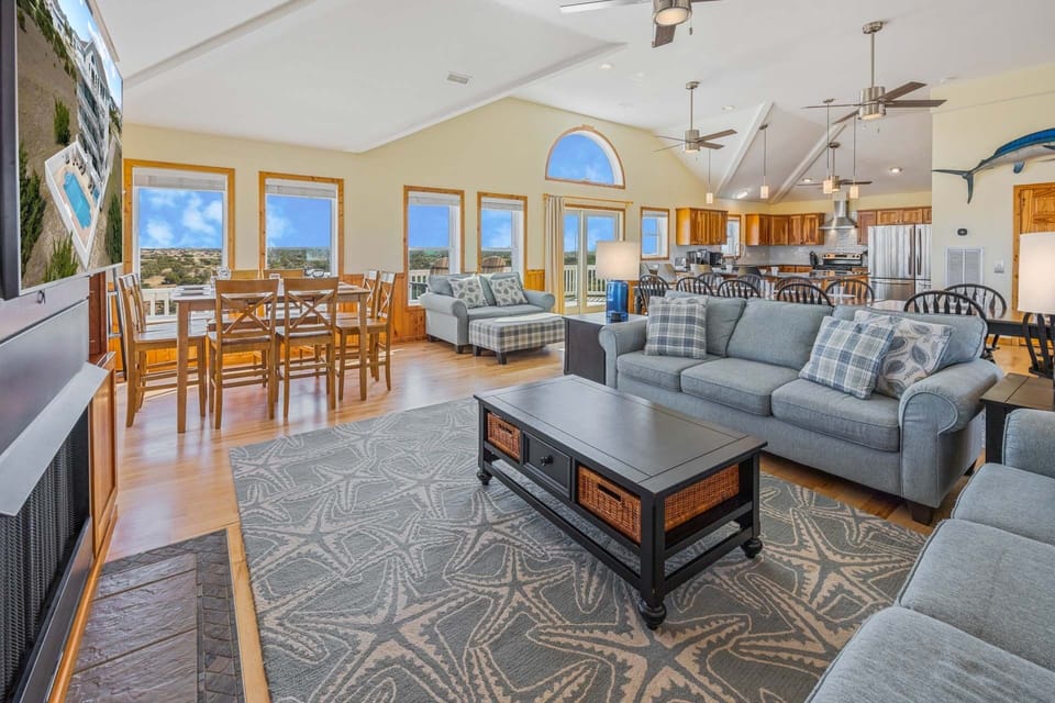 The heart of the home, a great room with vaulted ceilings and expansive unobstructed views of the adjacent National Seashore stretching south, as far as the eye can see.