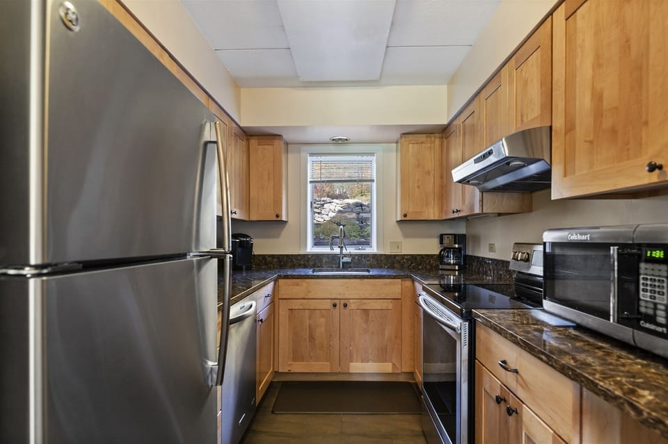 The well-equipped galley kitchen provides all the comforts of cooking in your own home