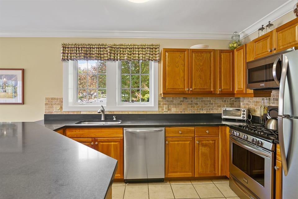 Open Kitchen with Stainless Steel Appliances
