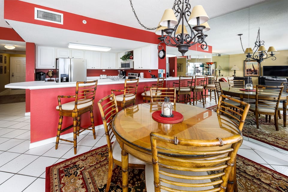 Dining Area - The dining room table seats 4 but there are more seats available at the breakfast bar