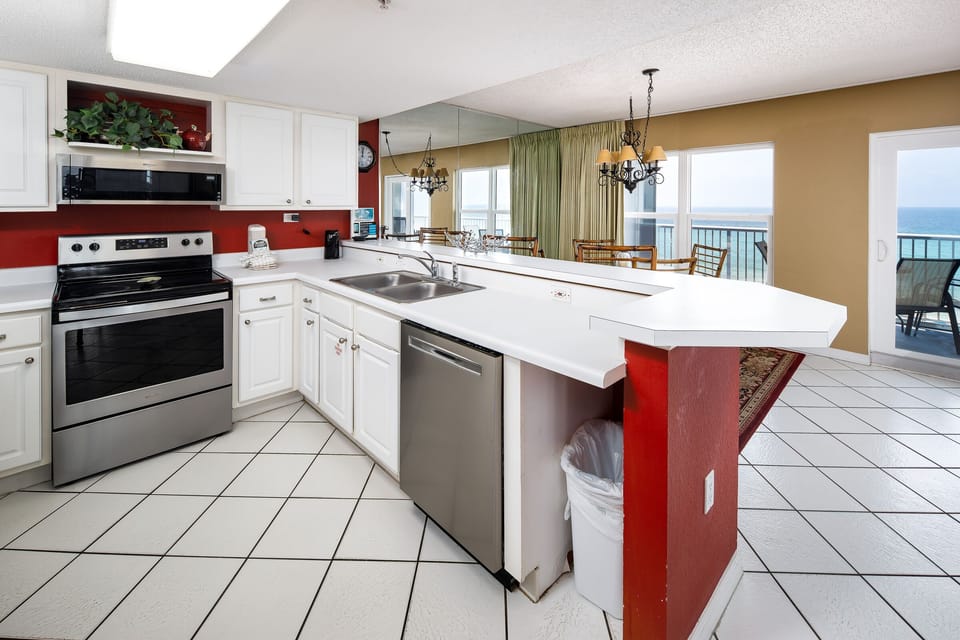 Kitchen - Fully stocked kitchen features all stainless steel appliances.