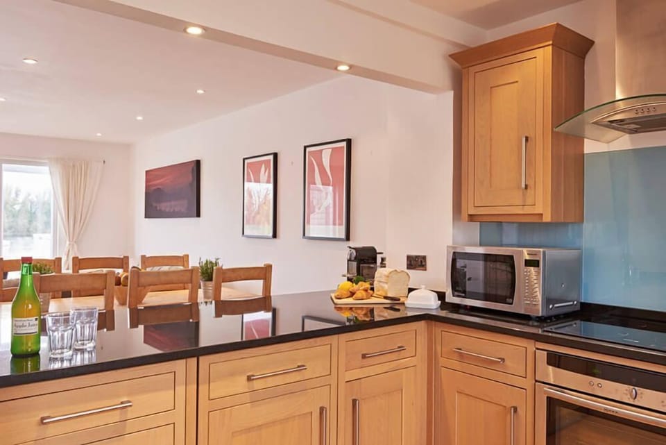 Ground floor: The well equipped U-shaped kitchen with breakfast bar and stools