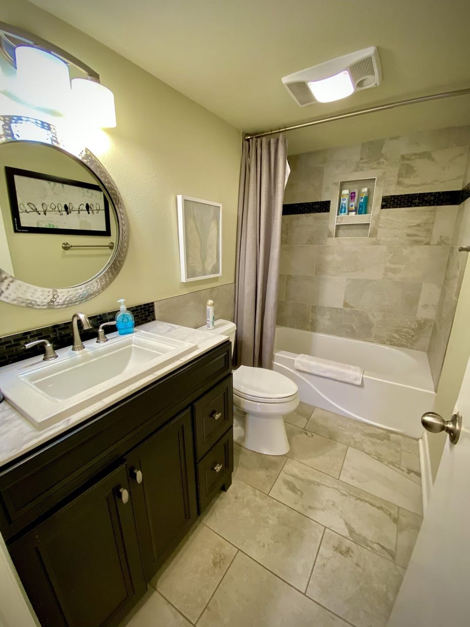 The hall bath has a tub and shower combo. Perfect for a relaxing bath!