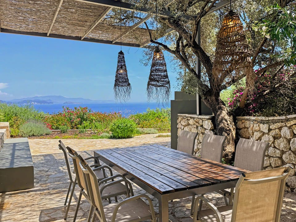 Enjoy al fresco dining surrounded by greenery and Ionian Sea vistas.