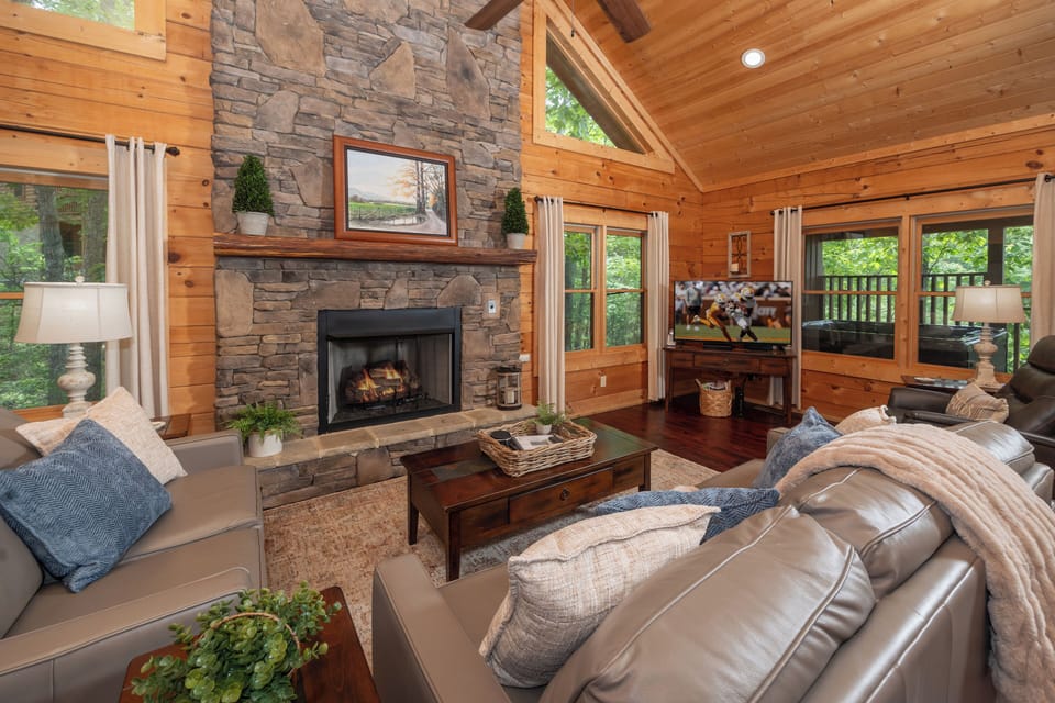 Living room in Four Oaks Lodge with electric fireplace.