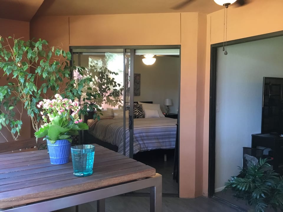Balcony with ceiling fan and light, high-top table and 4 chairs