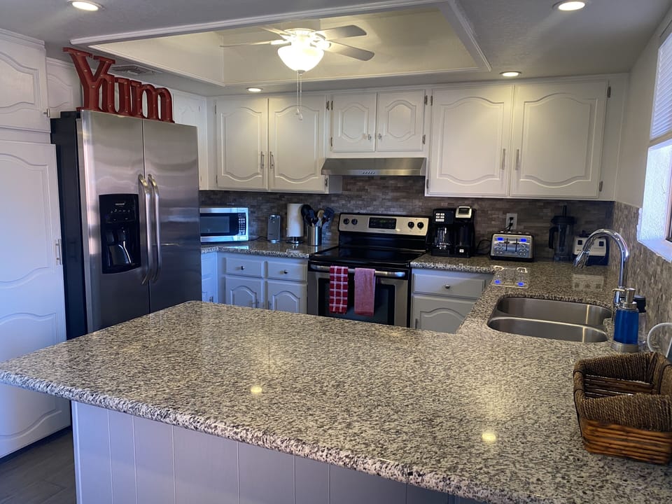 Stainless steel appliances compliment fully-equipped kitchen