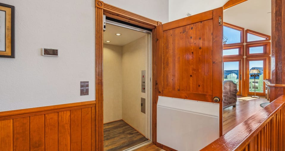 Surf or Sound Realty - 892 - Queen Anne's Revenge - Elevator - Label